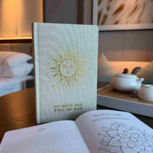 bG9jYWw6Ly9tZWRpYS9ITS9BQy82MFIzMEMxSjYwV0tBQ0hNL2FmOThjYzQzLmpwZWc.webp Ivory Gratitude Journal with Gold Lining - 120 pages - My Days are Full of Sun