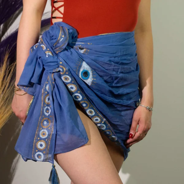 bG9jYWw6Ly9tZWRpYS9TUS8wRC82MFIzMEMxSDc0VEswRFNRL2Y3MDcwMDg3LmpwZWc.webp Nomad Sari On the Med Collection - Pareo - Rich Blue and Gold Hand Painted Evil Eye Design