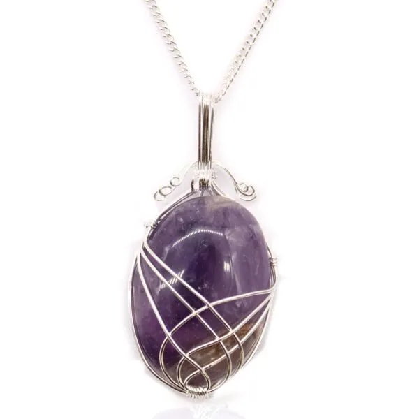 Elegant silver wire-wrapped amethyst pendant necklace with deep purple oval gemstone.