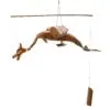 Wooden hanging mobile sculpture shaped like a handmade dragon or sea creature with articulated joints.
