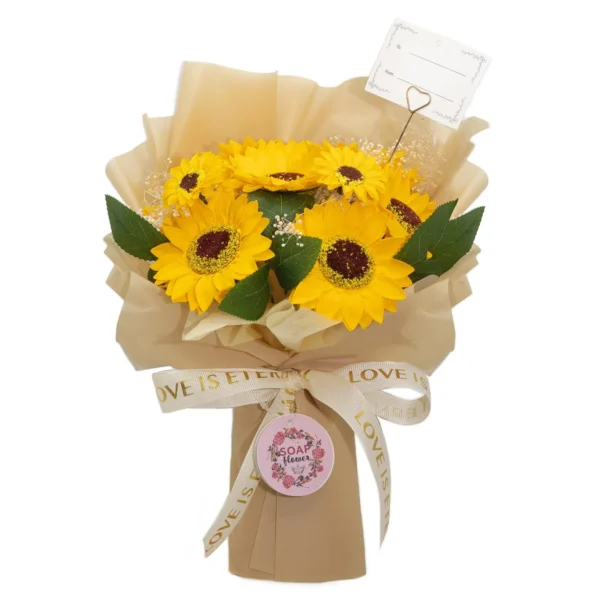 Sunflower Soap Flower Bouquet Beige Wrap - Love Is Eternal A yellow sunflower soap flower bouquet wrapped in beige paper with a cream “Love is Eternal” ribbon.