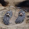 bG9jYWw6Ly9tZWRpYS8xUC9KQy82MFIzMEMxRzZNVEtKQzFQL2MzNTNlYjljLmpwZWc.webp Silver and Gold Earring - Angel Wings