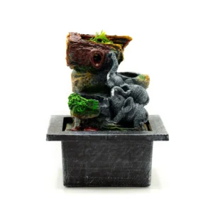 Elephant Resin Tabletop Fountain Grey - Natural Rock Waterfall A tabletop elephant waterfall fountain with rocky design and green plants on a black stone base.