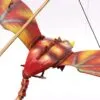 A handcrafted wooden bird mobile painted in red, yellow, and orange, suspended by black strings.