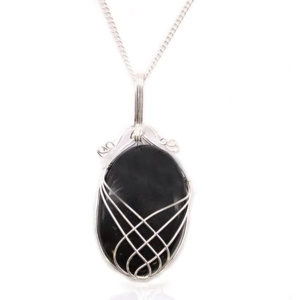 Handcrafted silver wire-wrapped necklace with polished oval black gemstone on a fine silver chain.