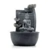 Stone-effect grey Buddha meditation fountain with lotus flower and cascading water bowls for tranquillity.