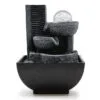 Modern charcoal stone tabletop fountain with tiered bowls and a clear glass sphere.