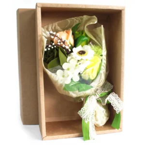 Elegant cream and yellow soap flower bouquet with lace ribbon in a brown gift box.