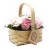 Handcrafted wicker basket with pink and white soap flowers, perfect for elegant gifting or home décor.