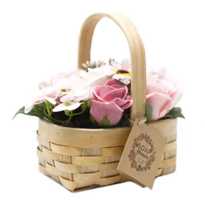 Handcrafted wicker basket with pink and white soap flowers, perfect for elegant gifting or home décor.