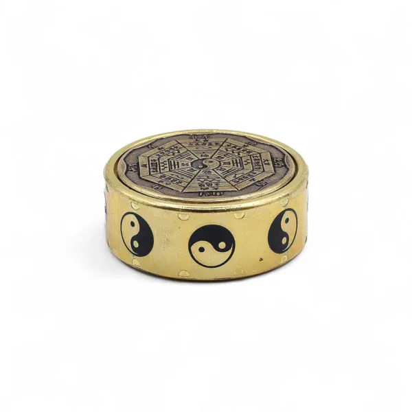 Solid brass box featuring black enamelled Yin-Yang symbols and an engraved Bagua lid.