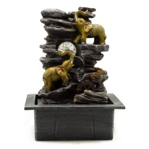 Golden elephant tabletop fountain with crystal orb, rocky design, and rotating water wheel.