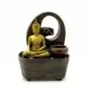Golden Buddha Resin Fountain Brown Arch - Tranquil Waterflow Golden Buddha tabletop fountain with brown arch, flowing water feature, and colourful decorative stones.