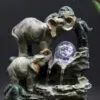 Elephant Water Fountain Resin Sculpture Grey - LED Globe Grey resin elephant water fountain with glowing LED crystal globe on textured rocky base.