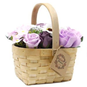 Handmade wicker basket with lilac and white soap flowers, perfect for decorative or gift use.