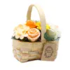 Scented orange soap roses and flowers in a woven wooden basket.