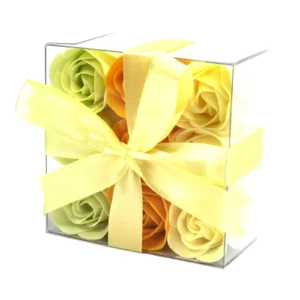 Pastel Soap Rose Gift Box Clear Acrylic - Yellow Ribbon Clear acrylic gift box with pastel soap roses and a yellow satin ribbon bow.
