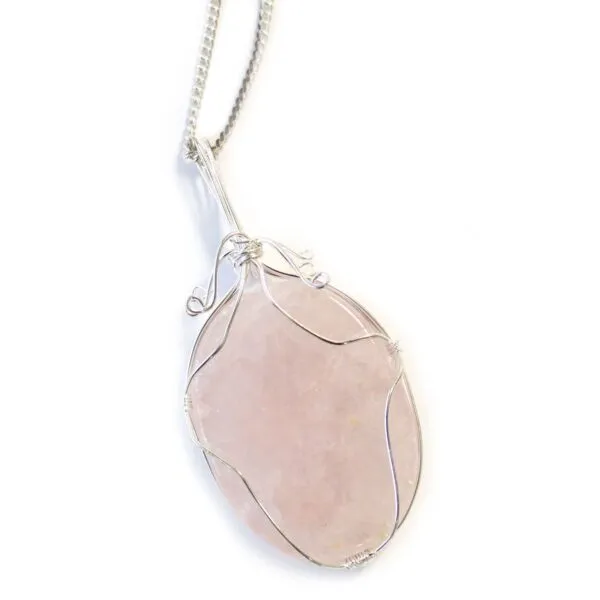 Handcrafted silver wire-wrapped rose quartz pendant necklace with polished pink gemstone on white background.