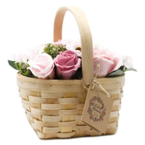 Handmade pink and white soap flower basket with wooden handle and rustic kraft tag.