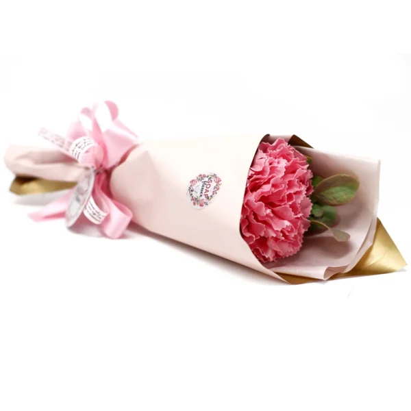 Elegant pink carnation soap flower bouquet wrapped in blush and gold paper with satin ribbon.
