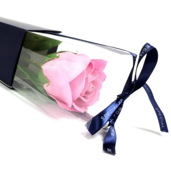 Elegant pink soap rose in navy wrap with ribbon, perfect for romantic or special gifting.