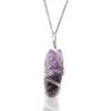 Handcrafted silver wire wrapped raw amethyst crystal pendant necklace on a fine silver chain.