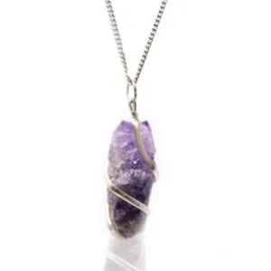 Handcrafted silver wire wrapped raw amethyst crystal pendant necklace on a fine silver chain.