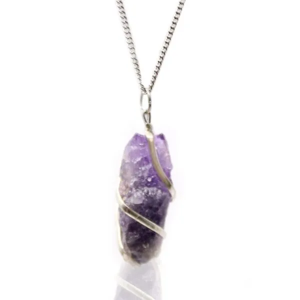 Handcrafted silver wire wrapped raw amethyst crystal pendant necklace on a fine silver chain.