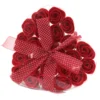 Heart-shaped clear box with red soap roses and sheer red polka dot ribbon bow.