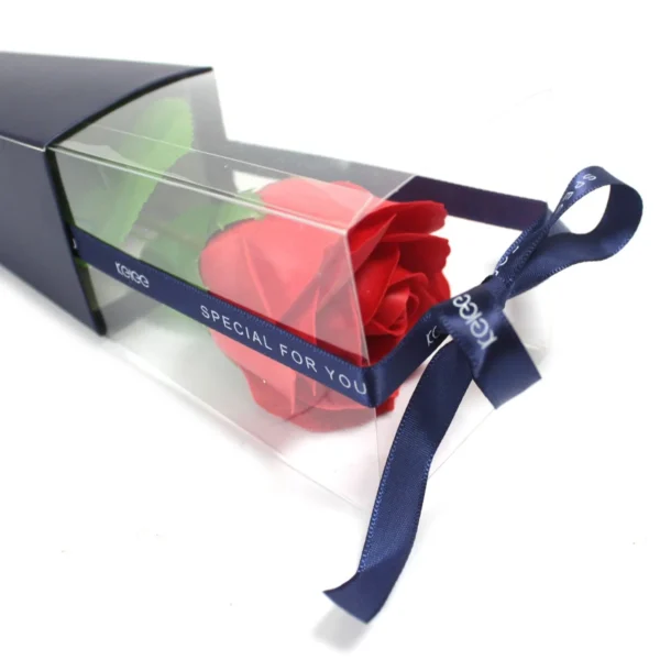 Elegant red soap rose in navy blue gift box with clear cover and satin ribbon.