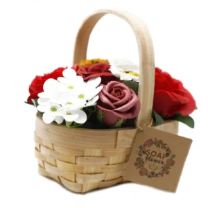 Handmade wicker basket with red, white, and pink soap roses and green leaves.