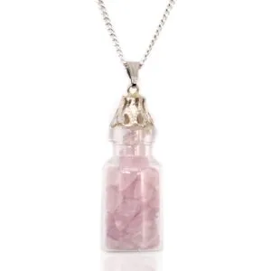 Silver necklace with glass bottle pendant filled with pink rose quartz crystals.
