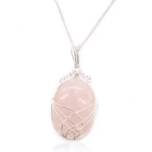 Elegant silver wire-wrapped rose quartz pendant necklace on a delicate silver chain.