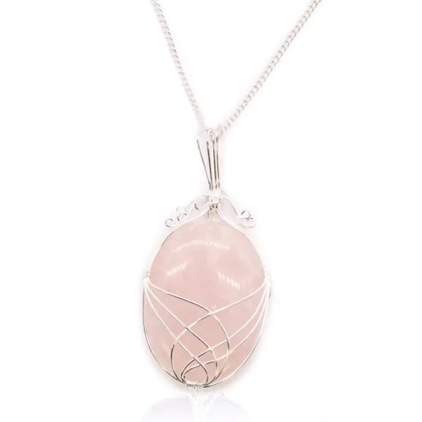 Elegant silver wire-wrapped rose quartz pendant necklace on a delicate silver chain.