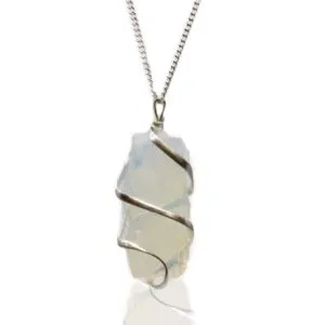 Silver wire-wrapped opalescent gemstone pendant necklace with raw crystal on white background.