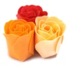 Red, orange, and peach foam roses arranged together on a clean white background.