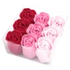 Nine ombre soap roses from red to pink arranged in a clear decorative gift box.
