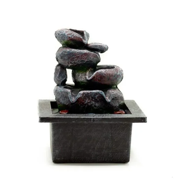Small grey tabletop rock water fountain with cascading stones and tranquil decorative design.