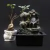 Buddha Face Planter And Elephant Fountain - White Grey LED White Buddha face planter and grey elephant water fountain with glowing LED glass sphere.
