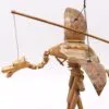 Handcrafted wooden dragon marionette with movable wings, folk-inspired design, and natural brown finish.