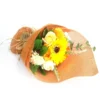 Sunflower and cream soap flower bouquet wrapped in orange mesh with rustic raffia tie.