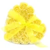 Heart-shaped gift box with yellow soap roses and a sheer yellow ribbon bow.