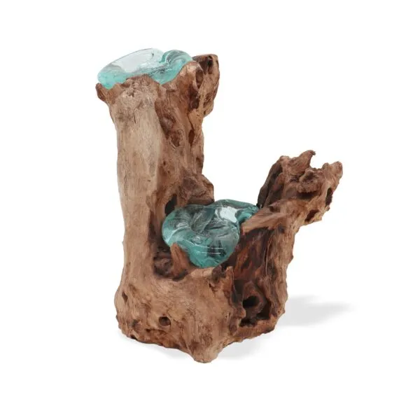 Molten glass and driftwood decorative sculpture blending blue-green glass with natural brown wood.