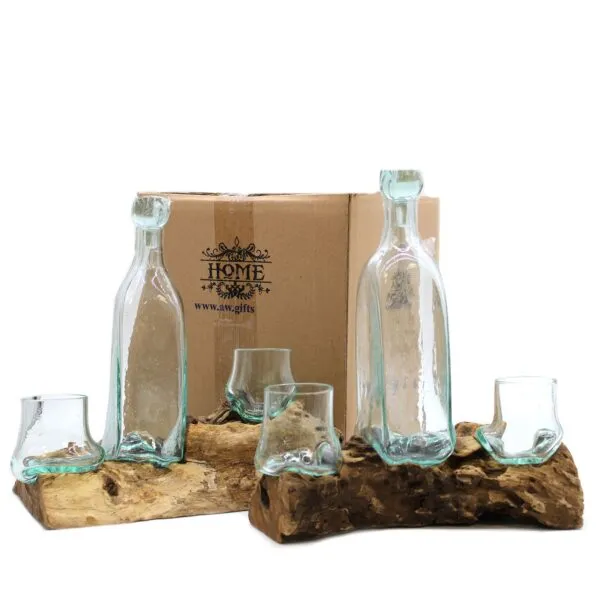 Handcrafted Glass And Driftwood Set - Rustic Recycled Design Two handmade glass bottles and four small cups fused to natural driftwood bases before a HOME box.