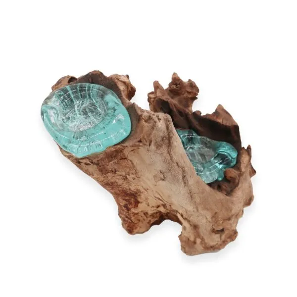 A handcrafted driftwood and aqua-blue molten glass decorative bowl with natural organic texture.