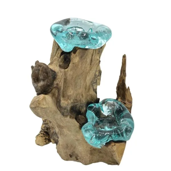 Hand-blown aqua glass bowls fused to rustic driftwood, forming an artistic natural decorative piece.