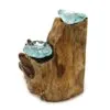 Hand-blown glass bowls fused into natural driftwood sculpture with organic textures and bluish-green hues.