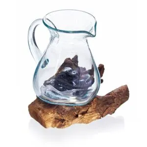 Hand-blown glass pitcher fused to natural wooden base with organic, rustic, artistic design.