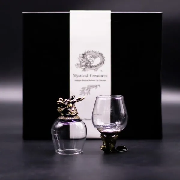 Pair of bronze dragon-themed antique glasses with black gift box labelled “Mystical Creatures.”