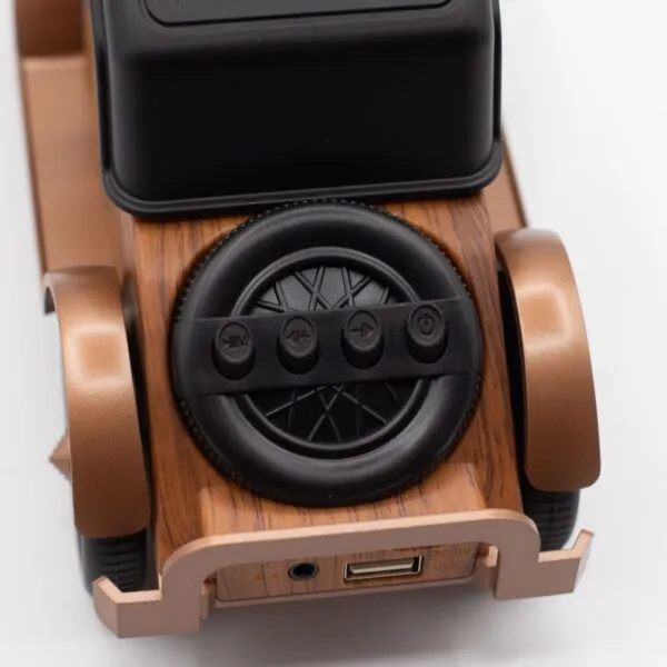 A retro-style wooden Bluetooth speaker with black controls and metallic bronze accents.